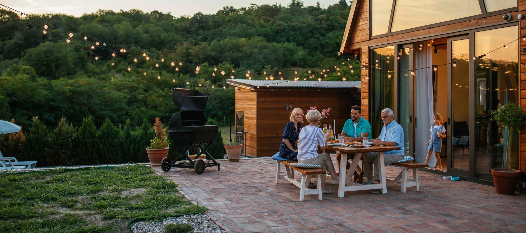 Family Dinner Around Dining Table Garden