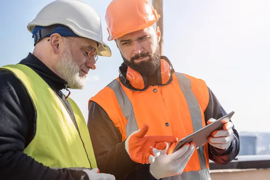 Industry engineering development management team working from a tablet connected to fastest WTC wireless powered by fibre internet Full Spectrum package with SmartBiz from WTC Communications Kingston